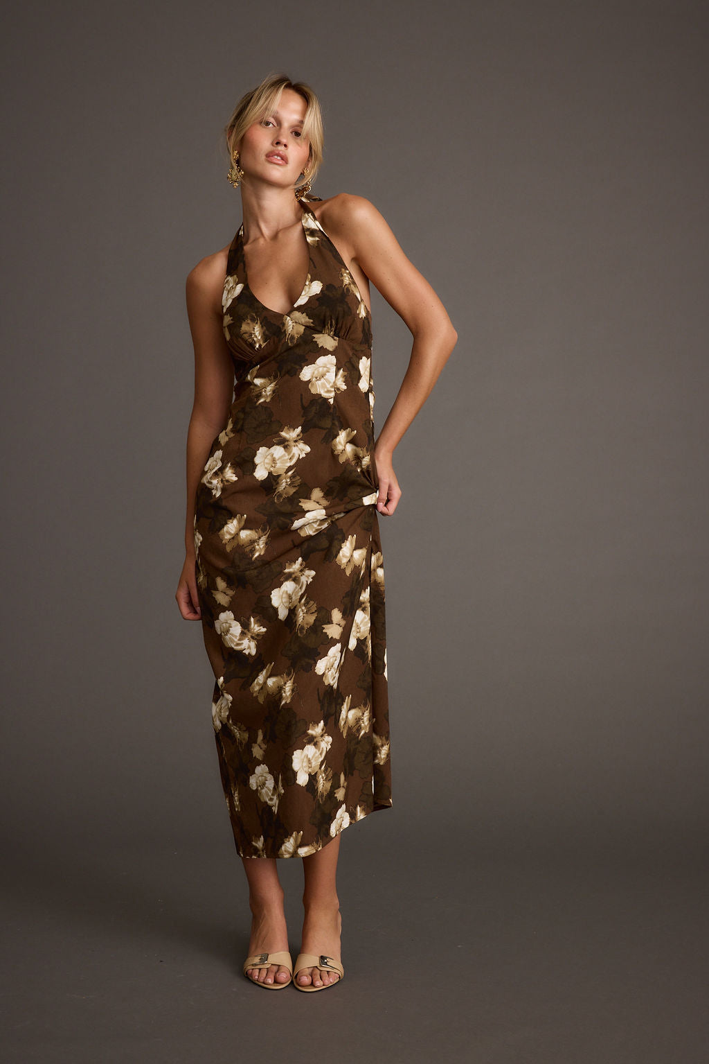 Brown halter maxi dress with elegant accents, a brown satin dress essential.