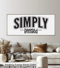 Negative space emphasizes the bold Christian typography in this oil painting art piece, 'Simply Blessed,' creating a striking contrast on the framed canvas.
