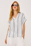 Tuscany Shirt in Linen Blend With Collar, Front Half Placket, Capped Cuff Sleeves, and Slightly-Boxy Fit Fit in Washed Blue Colorway - Upper Body Front View Featured on Model