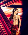 At the 2018 Miss Universe, Catriona Gray representing Philippines, wore a  gown by Mak Tumang. The dress was encrusted with Swarovski crystals in  12-toned color palette that ranged from yellow to dark