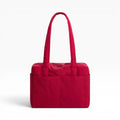 Cherry red tote bag with long handles and quilted front panels