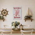 Dining room with a 'Lobster Shack Restaurant' sign, wooden table, and decorative elements.