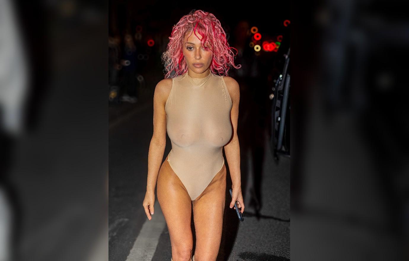 Bianca Censori Struts Around Paris In Sheer Body Suit & Pink Hair