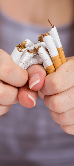 broken cigarettes in hands