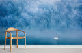 Ethereal Winter Wonderland mural wallpaper with swan, wooden chair, light flooring; serene room setting.