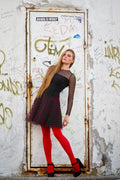 Woman Wearing Black and Red Long-sleeved Mini Dress and Red Leggings in  Front of a Closed White Metal Door · Free Stock Photo
